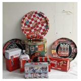 Coca-Cola collectibles including tins, trays, and