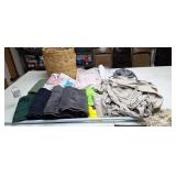 Hamper, old towels and sheets and dust mop