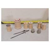 Wooden spoons, thimble, and leather needles