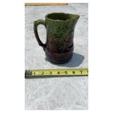 ANTIQUE MAJOLICA FLORAL EMBOSSED HANDLED PITCHER