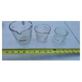 Fire King glass measuring cups, and 1 cup