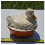 Ceramic duck on a nest