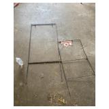 Two iron sign holders