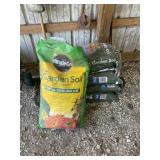 4 new bags of garden soil and 1 half full