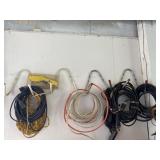 Hangers on wall w/extension cords, air hose