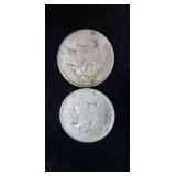Two silver peace dollars.
