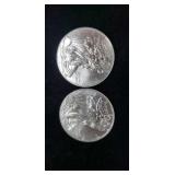 Two 2011 Silver Eagle Dollars.