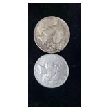 Two silver  peace dollars.