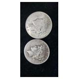 Two silver peace dollars.