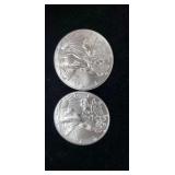Two 2016 Silver eagle dollars.