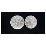 Two  2016 silver eagle dollars.