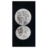 Two 2011 silver eagle  dollars.