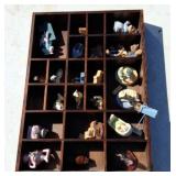 Shadow box with miniature figurines