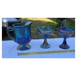 Three pieces of Carnival Glass one has chip on