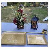 Gold trays, flower arrangement and plastic