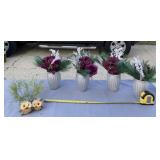 Hanging owl decorations and flower arrangements