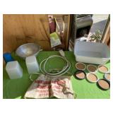 Plug with cord, drink coasters and strainer