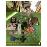 Eye liners, eye shadow, hair clips and mirror