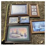 7 framed pictures from various artists like Lee