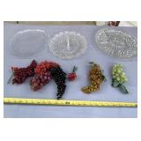 Three glass serving trays and grape decor