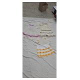 Three old crocheted aprons