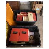 Two totes with lids and full of handyman books