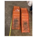 Two drive up car ramps.