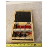 Craftsman router bits in wood case.