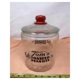 Tomï¿½s Toasted Peanuts jar with lid.