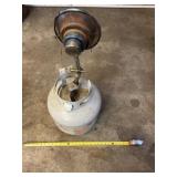 Empty propane tank with heater attachment.