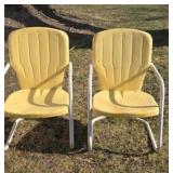 Vintage yellow metal lawn chairs.