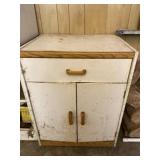 Wood cabinet with all conte to in it.