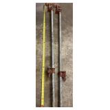 Pair of pipe clamps.