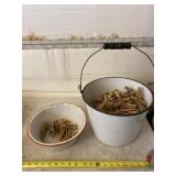 White enamel ware buckets and pan with clothes