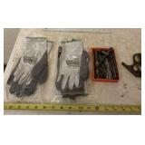 Gloves, ruler, drill bits and level.