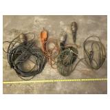 Four work lights with cords and extension cord.