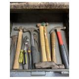 Hammers, pliers and screwdrivers.