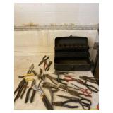 Steel tool box with pliers and cutters.