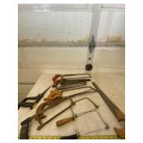 All hand saws on table.