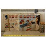 Jar with plastic bead pieces and Knit -O- Matic.