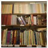 Three shelves of all books on them.