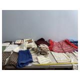 Kitchen aprons, place mats and towels.