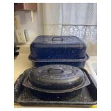 Speckled enamel roaster pans.