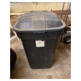 Trash can with lid and on wheels.