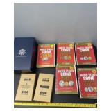 2000ï¿½s US coin value books and empty coin boxes.