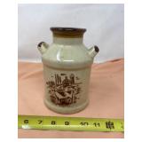 Tan and brown stoneware milk jug.