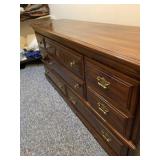Cherry and pecan dresser measures 64 inches wide