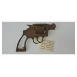 Appears to be a 38 Cal Smith & Wesson pistol