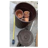 Trash Can Full of Clay Pots