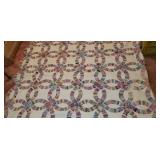 Handsewn wedding ring pattern quilt.